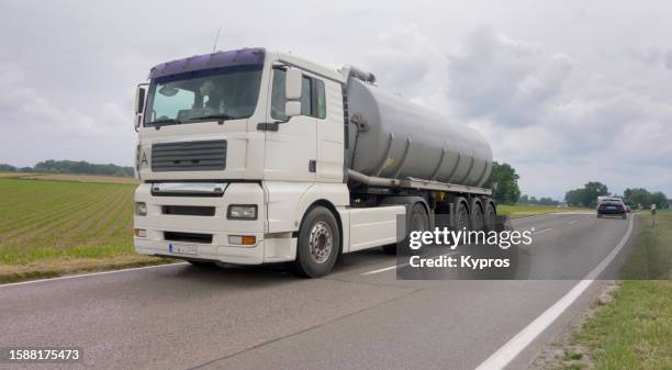 cargo lorry delivering goods - heating oil stock pictures, royalty-free photos & images