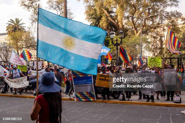 Indigenous protester holds a flag of Argentina during a demonstration against the constitutional reform promoted by Governor of Jujuy Gerardo Morales...