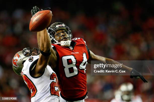 Roddy White of the Atlanta Falcons fails to pull in this reception against Leonard Johnson of the Tampa Bay Buccaneers at Georgia Dome on December...