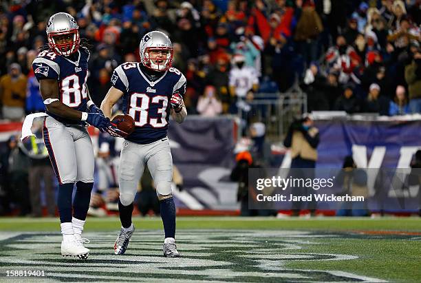 Wes Welker of the New England Patriots celebrates with teammate Deion Branch of the New England Patriots after scoring a touchdown in the first...