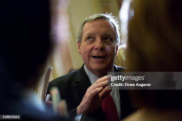 Senator Dick Durbin talks with reporters outside of the Senate Chamber on Capitol Hill December 30, 2012 in Washington, DC. The House and Senate are...