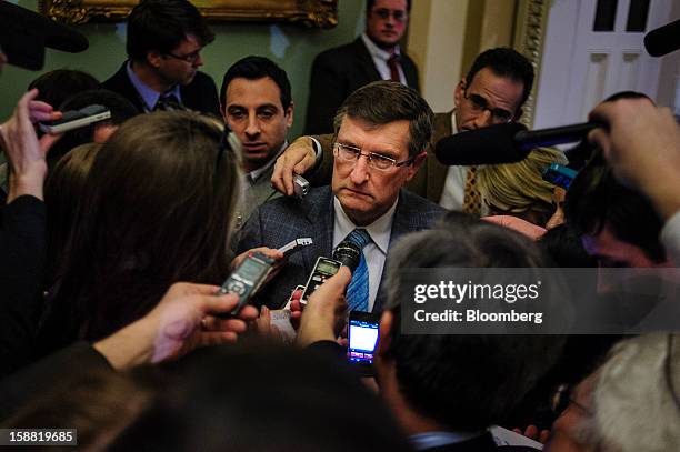 Senator Kent Conrad, a Democrat from North Dakota, speaks to members of the media following a party caucus meeting at the U.S. Capitol in Washington,...