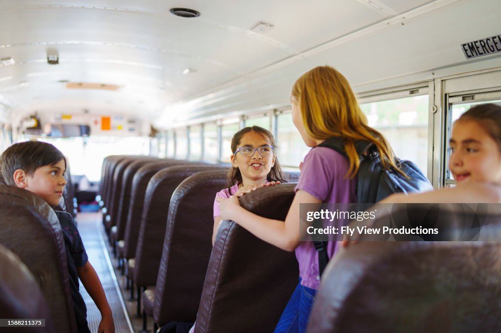 Kids Using Bus Happy Kids Riding On School Bus High-Res Stock Photo - Getty Images