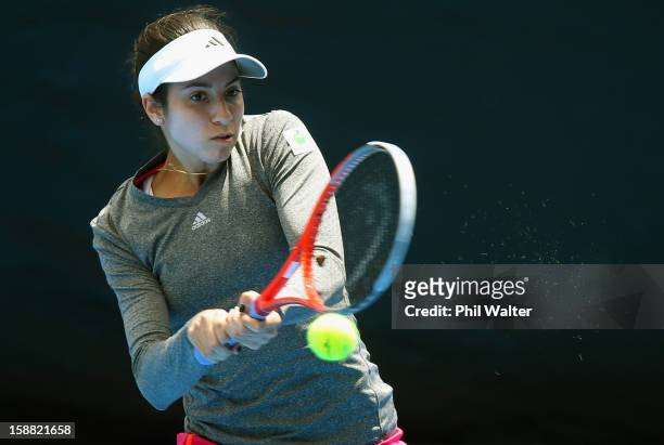 Christina McHale of the USA plays a backhand in her first round match against Pauline Parmentier of France during day one of the 2013 ASB Classic on...