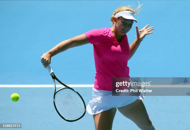 Coco Vandeweghe of the USA plays a backhand in her first round match against Eleni Daniilidou of Greece during day one of the 2013 ASB Classic on...