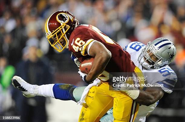 Alfred Morris of the Washington Redskins carries the ball against the defense of Ernie Sims of the Dallas Cowboys at FedExField on December 30, 2012...