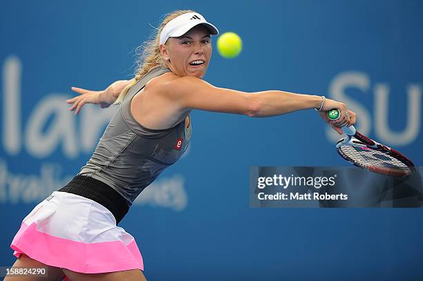 Caroline Wozniacki of Denmark plays a backhand in her match against Ksenia Pervak of Kazakhstan during day two of the Brisbane International at Pat...