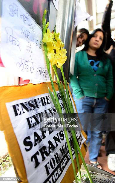 Students at a makeshift memorial to mourn the death of a 23-year-old gang rape victim near a bus stop at Munirka in New Delhi on Saturday. The girl...