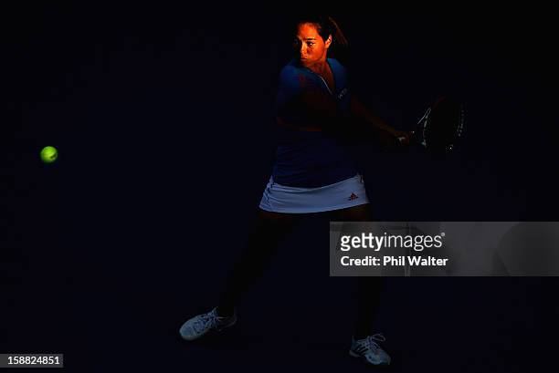 Jamie Hampton of the USA plays a backhand in her first round match against Jie Zheng of China during day one of the 2013 ASB Classic on December 31,...