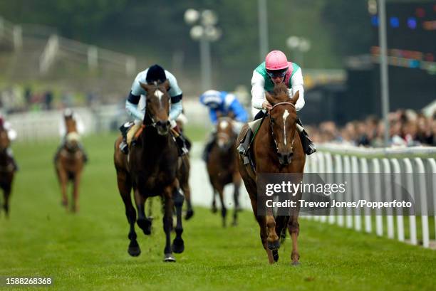 Irish Jockey Richard Hughes riding Fragrant View winning the Bryant Homes Maiden Stakes at Chester, 7th May 2002. Placed second Irish Jockey Johnny...