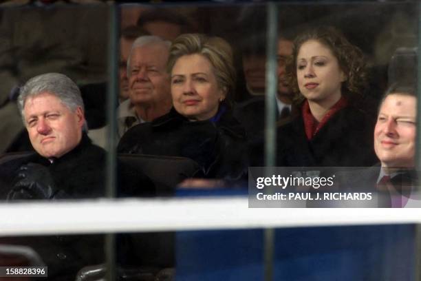 Outgoing President Bill Clinton, former First Lady and now U.S. Senator Hillary Clinton, daughter Chelsea and outgoing Vice President Al Gore watch...