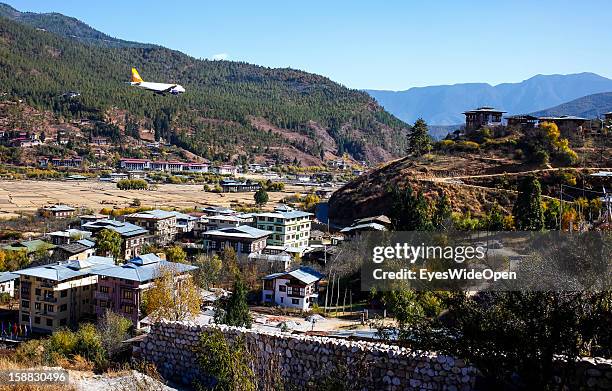 Paro, BHUTAN An aeroplane of the Royal Bhutan Airline Drukair on arrival at Paro Airport , one of the most dangerous airports in the world on...