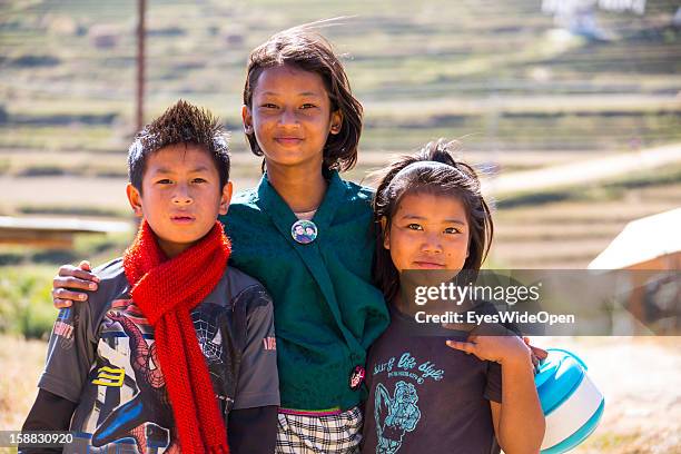 Young children of the village Chimi Lhakhang in the Punakha Valley with its temple, monastery is renowned for its fertility blessings, phallus or...