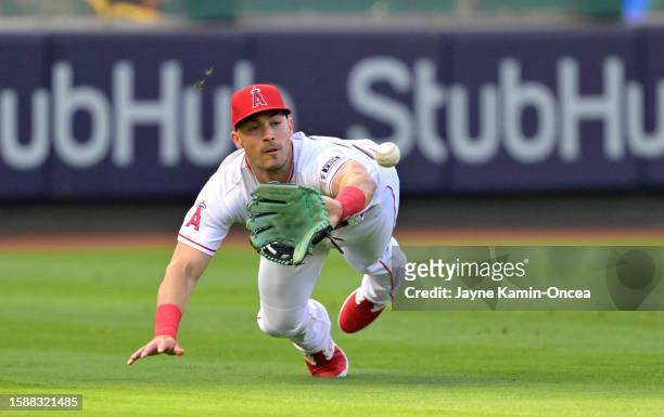Randal Grichuk of the Los Angeles Angels makes a catch off a ball hit by Wilmer Flores of the San Francisco Giants in the first inning at Angel...
