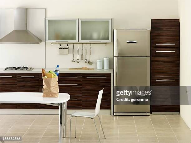 shopping bag in a kitchen - refrigerator stock pictures, royalty-free photos & images