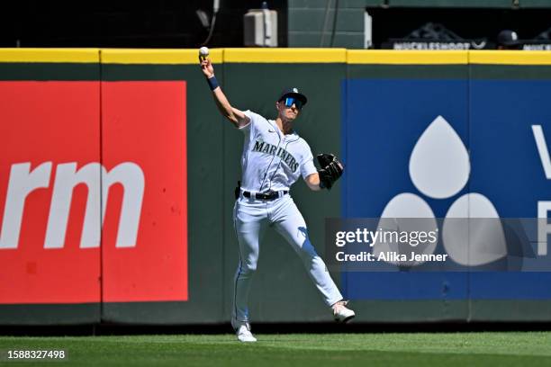 Dominic Canzone of the Seattle Mariners throws the ball from the outfield during the second inning against the Boston Red Sox at T-Mobile Park on...