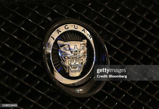 Jaguar badge sits on the grille of an automobile inside a Jaguar Land Rover auto dealership in Moscow, Russia, on Thursday, Dec. 27, 2012. Tata...