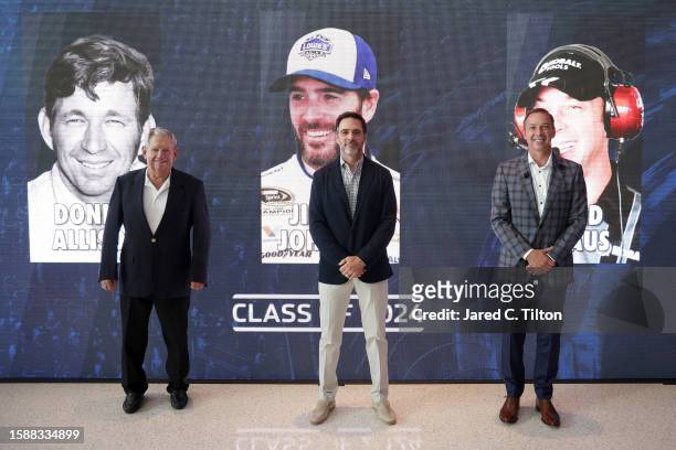 Donnie Allison, Jimmie Johnson, and Chad Knaus pose for a photo after receiving the votes to be inducted during the NASCAR Hall of Fame Voting Day at...