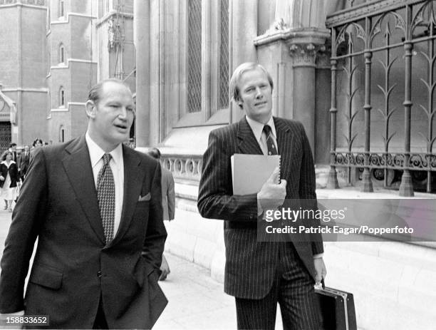 Kerry Packer and Tony Greig outside the High Court in London at the end of the first day's hearing on September 26, 1977 in London, England.
