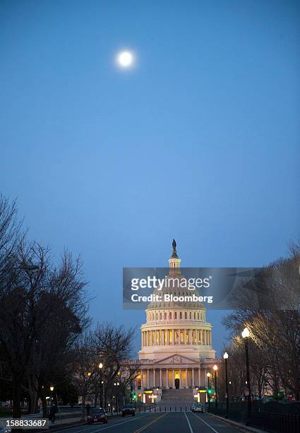 Dawn breaks at the U.S. Capitol in Washington, D.C., U.S., on Monday, Dec. 31, 2012. U.S. Lawmakers hurtled toward a midnight deadline to avert...