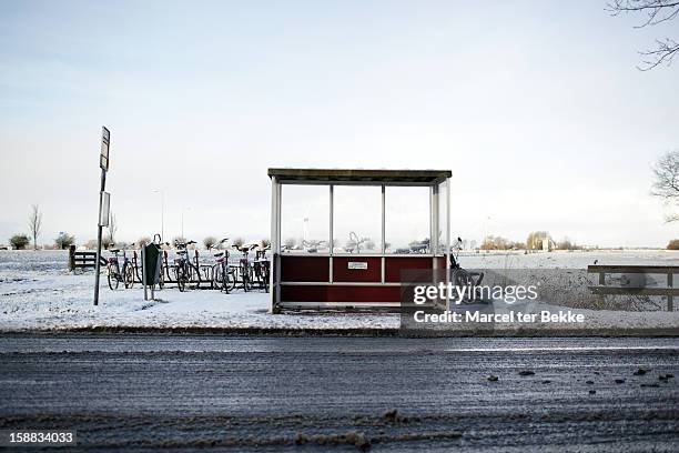 dutch busstop in winter - absence stock pictures, royalty-free photos & images