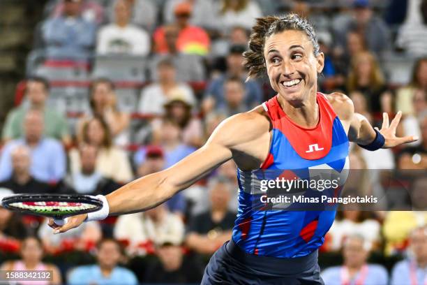 Petra Martic of Croatia hits a return against Aryna Sabalenka of Belarus on Day 3 during the National Bank Open at Stade IGA on August 9, 2023 in...