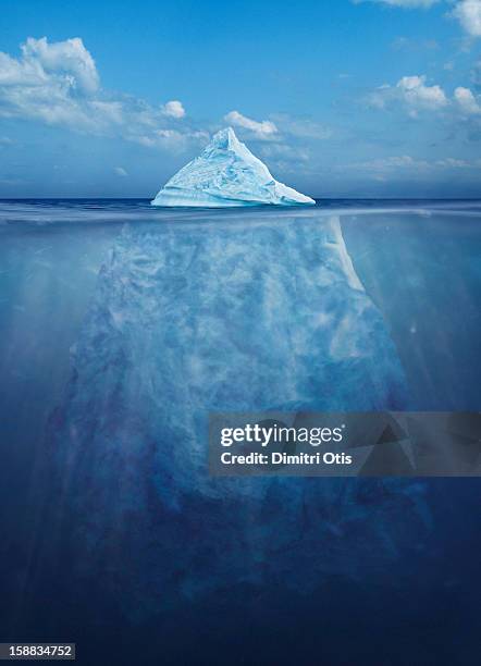 floating iceberg, showing its size under water - underwater iceberg stock-fotos und bilder