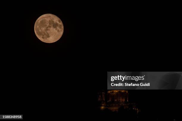 The Sturgeon Super Moon is seen near of Basilica di Superga on August 2, 2023 in Turin, Italy. This is the first of two super moons in the month of...