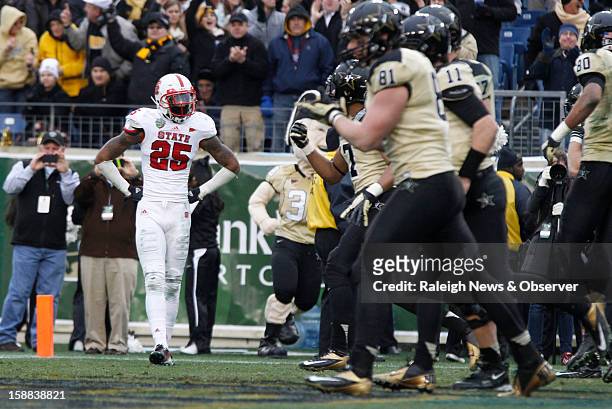 State safety Dontae Johnson watches as Vanderbilt celebrates after Vanderbilt quarterback Jordan Rodgers ran in for a 15-yard touchdown during the...