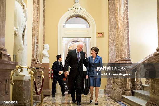 Sen. Jon Cornyn and U.S. Sen. Susan Collins talk on their way to a closed-door meeting with Senate Republicans on Capitol Hill on December 31, 2012...