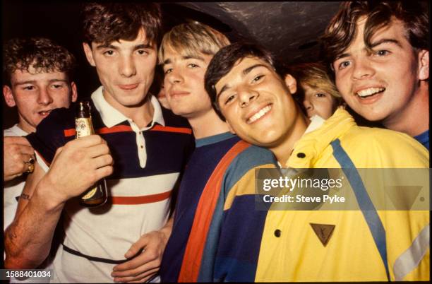 Members of an English hooligan firm 'The Leicester Baby Squad' congregate in a city centre pub before a Leicester City football game. 1984