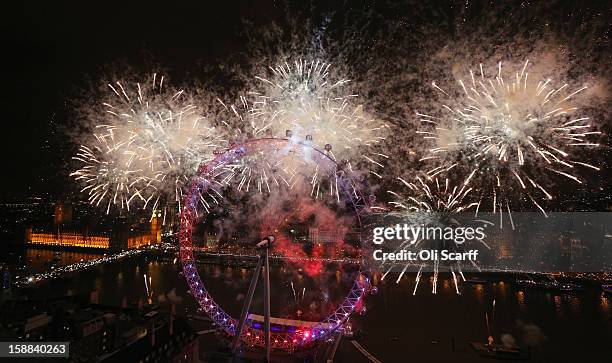 Fireworks light up the London skyline and Big Ben just after midnight on January 1, 2013 in London, England. Thousands of people lined the banks of...