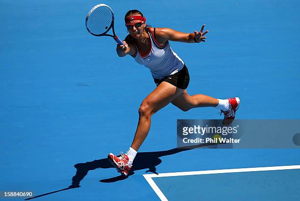 Yaroslava Shvedova of Kazakhstan plays a forehand in her first round match against Lara Arruabarrena-Vecino of Spain during day two of the 2013 ASB...