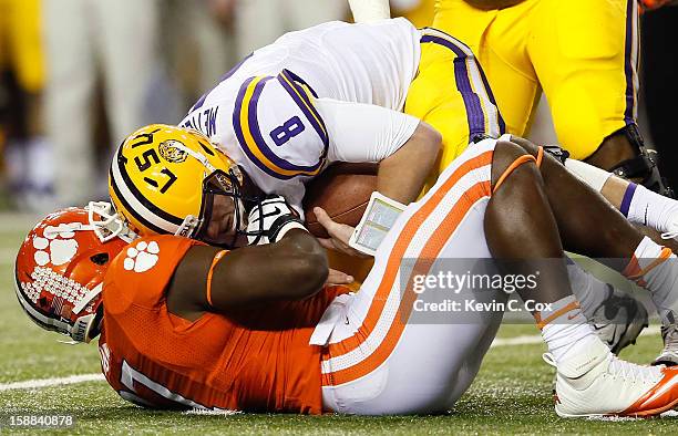 Malliciah Goodman of the Clemson Tigers sacks Zach Mettenberger of the LSU Tigers during the 2012 Chick-fil-A Bowl at Georgia Dome on December 31,...