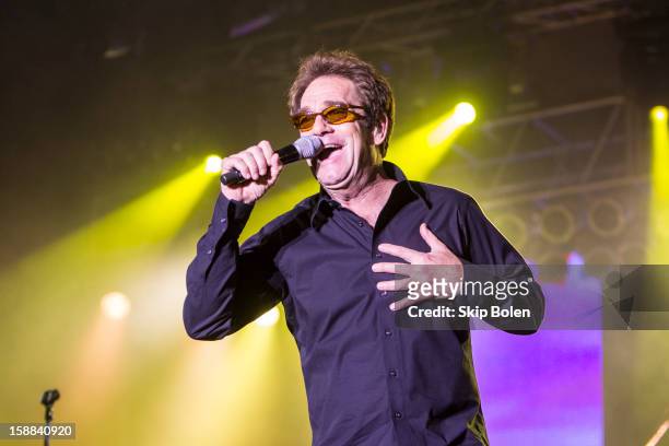 Huey Lewis of Huey Lewis and The News performs during the 2013 Allstate fan fest at the Allstate Sugar Bowl in the Jax Brewery Parking Lot on...