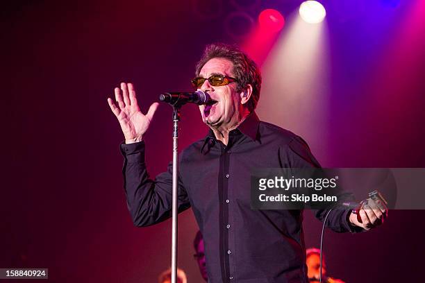 Huey Lewis of Huey Lewis and The News performs during the 2013 Allstate fan fest at the Allstate Sugar Bowl in the Jax Brewery Parking Lot on...