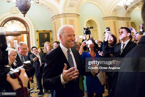 Vice President Joe Biden arrives for a closed-door meeting with Senate Democrats to urge them to support a tentative tax agreement with Senate...