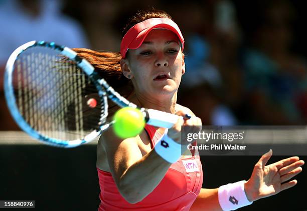 Agnieszka Radwanska of Poland plays a forehand in her first round match against Greta Arn of Hungary during day two of the 2013 ASB Classic on...