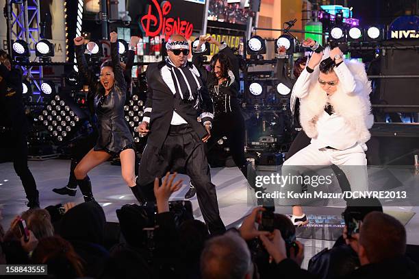 Hammer and Psy perform onstage at Dick Clark's New Year's Rockin' Eve with Ryan Seacrest 2013 in Times Square on December 31, 2012 in New York City,...