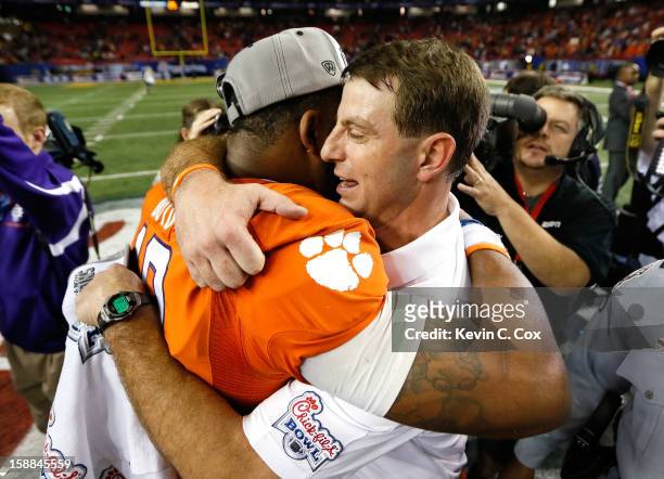 Head coach Dabo Swinney of the Clemson Tigers celebrates with Tajh Boyd after their 25-24 win over the LSU Tigers during the 2012 Chick-fil-A Bowl at...