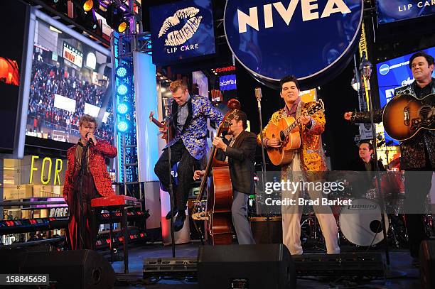 Cast members from "Million Dollar Quartet" perform on the NIVEA Kiss Stage in Times Square on New Year's Eve 2013 on December 31, 2012 in New York...