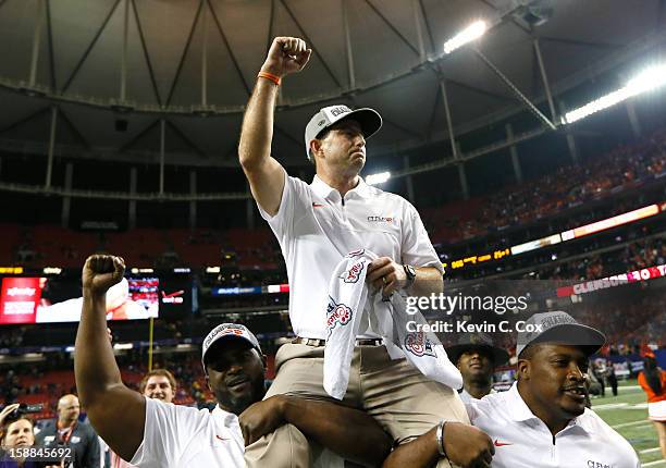 Head coach Dabo Swinney of the Clemson Tigers celebrates their 25-24 win over the LSU Tigers during the 2012 Chick-fil-A Bowl at Georgia Dome on...