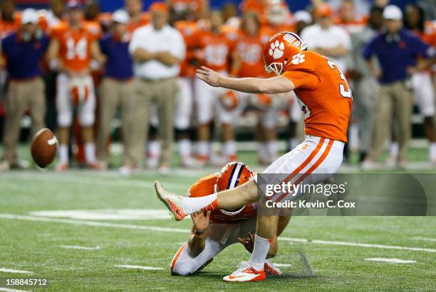 Chandler Catanzaro of the Clemson Tigers kicks the game-winning field goal against the LSU Tigers during the 2012 Chick-fil-A Bowl at Georgia Dome on...