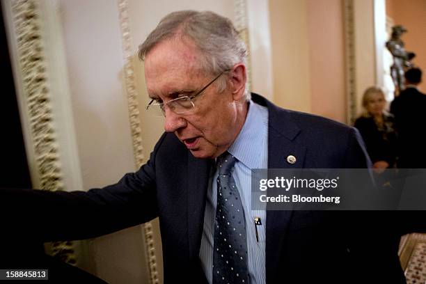 Senator Harry Reid, a Democrat from Nevada, walks out of a Democratic caucus meeting at the U.S. Capitol in Washington, D.C., U.S., on Monday, Dec....