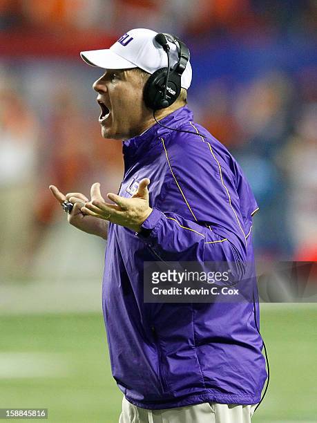Head coach Les Miles of the LSU Tigers questions a call in the final minutes against the Clemson Tigers during the 2012 Chick-fil-A Bowl at Georgia...