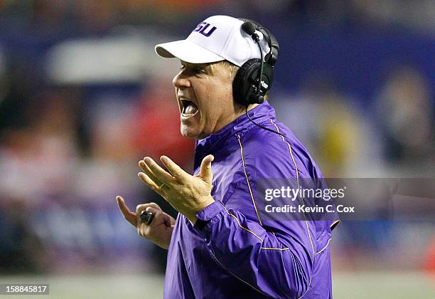 Head coach Les Miles of the LSU Tigers questions a call in the final minutes against the Clemson Tigers during the 2012 Chick-fil-A Bowl at Georgia...