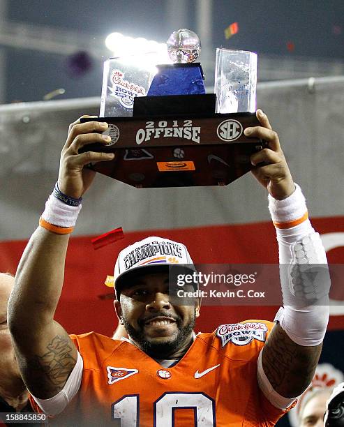 Tajh Boyd of the Clemson Tigers holds his Offensive MVP trophy after their 25-24 win over the LSU Tigers during the 2012 Chick-fil-A Bowl at Georgia...