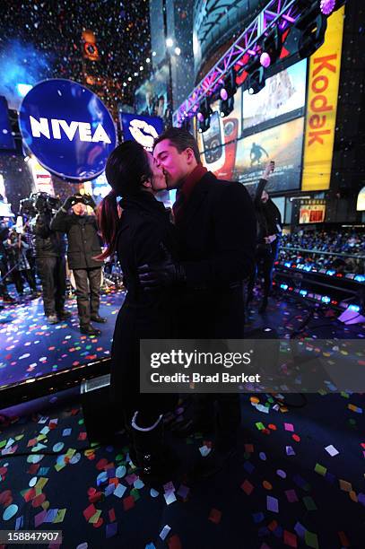 Mario Lopez and Courtney Lopez, co-hosts of the NIVEA Kiss Stage in Times Square, share the "Kiss of the Year"on New YearÕs Eve 2013 in New York City.