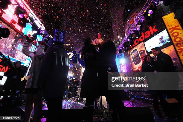 Mario Lopez and Courtney Lopez, co-hosts of the NIVEA Kiss Stage in Times Square, share the "Kiss of the Year"on New YearÕs Eve 2013 in New York City.