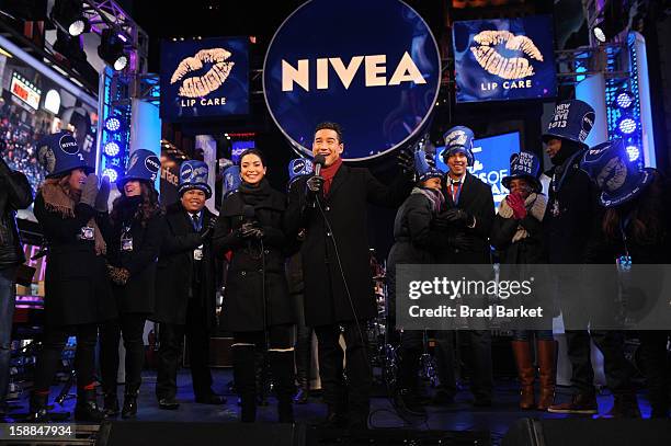Mario Lopez and Courtney Lopez, co-hosts of the NIVEA Kiss Stage in Times Square, help others prepare for the "Kiss of the Year"on New YearÕs Eve...